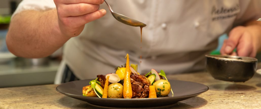 The chef plating a dinner course