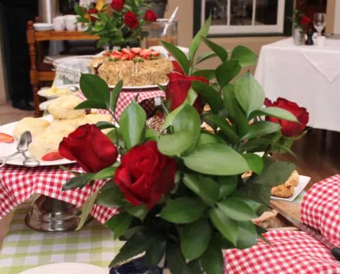 A celebration table dressed with red roses